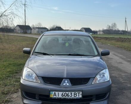 Серый Мицубиси Лансер, объемом двигателя 1.6 л и пробегом 114 тыс. км за 4000 $, фото 1 на Automoto.ua