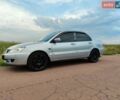 Серый Мицубиси Лансер, объемом двигателя 1.58 л и пробегом 274 тыс. км за 3950 $, фото 1 на Automoto.ua