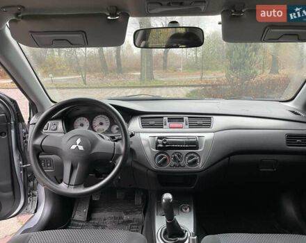 Сірий Міцубісі Lancer, об'ємом двигуна 1.59 л та пробігом 219 тис. км за 4500 $, фото 17 на Automoto.ua