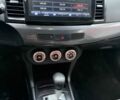 Серый Мицубиси Лансер, объемом двигателя 2 л и пробегом 239 тыс. км за 5500 $, фото 6 на Automoto.ua