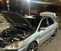 Сірий Міцубісі Lancer, об'ємом двигуна 1.58 л та пробігом 290 тис. км за 2199 $, фото 1 на Automoto.ua