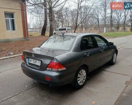 Серый Мицубиси Лансер, объемом двигателя 1.58 л и пробегом 205 тыс. км за 3300 $, фото 3 на Automoto.ua