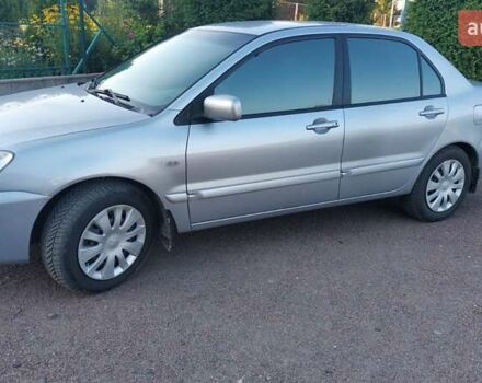 Серый Мицубиси Лансер, объемом двигателя 1.6 л и пробегом 117 тыс. км за 3980 $, фото 8 на Automoto.ua