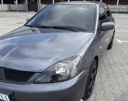 Серый Мицубиси Лансер, объемом двигателя 1.58 л и пробегом 250 тыс. км за 4300 $, фото 10 на Automoto.ua