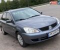 Серый Мицубиси Лансер, объемом двигателя 1.58 л и пробегом 250 тыс. км за 4200 $, фото 2 на Automoto.ua