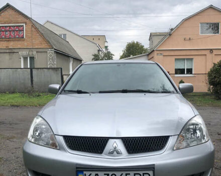 Сірий Міцубісі Lancer, об'ємом двигуна 1.58 л та пробігом 240 тис. км за 4299 $, фото 12 на Automoto.ua