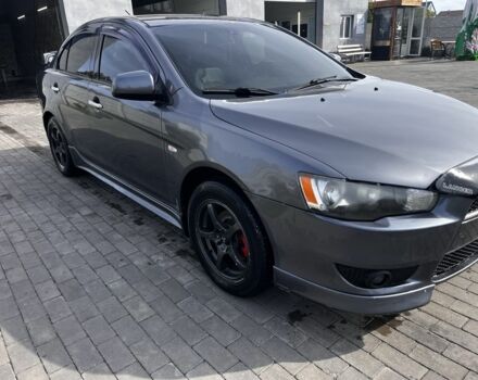 Серый Мицубиси Лансер, объемом двигателя 2 л и пробегом 224 тыс. км за 6500 $, фото 1 на Automoto.ua