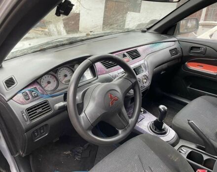 Серый Мицубиси Лансер, объемом двигателя 1.6 л и пробегом 280 тыс. км за 900 $, фото 4 на Automoto.ua