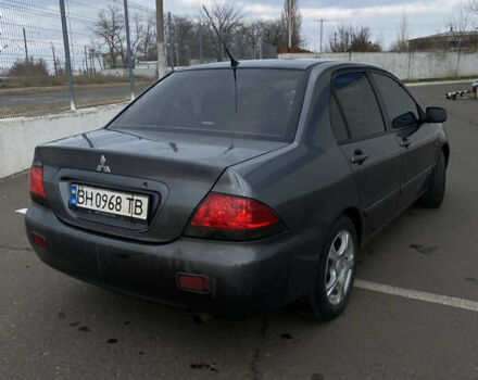 Сірий Міцубісі Lancer, об'ємом двигуна 1.58 л та пробігом 293 тис. км за 4350 $, фото 5 на Automoto.ua