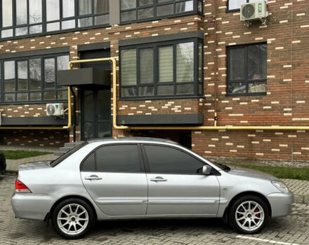 Сірий Міцубісі Lancer, об'ємом двигуна 1.6 л та пробігом 269 тис. км за 3999 $, фото 13 на Automoto.ua