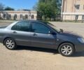 Сірий Міцубісі Lancer, об'ємом двигуна 1.6 л та пробігом 254 тис. км за 4600 $, фото 1 на Automoto.ua