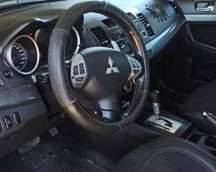 Серый Мицубиси Лансер, объемом двигателя 2 л и пробегом 77 тыс. км за 9800 $, фото 4 на Automoto.ua