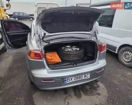 Серый Мицубиси Лансер, объемом двигателя 2 л и пробегом 175 тыс. км за 6500 $, фото 7 на Automoto.ua