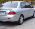 Сірий Міцубісі Lancer, об'ємом двигуна 1.6 л та пробігом 176 тис. км за 4999 $, фото 1 на Automoto.ua