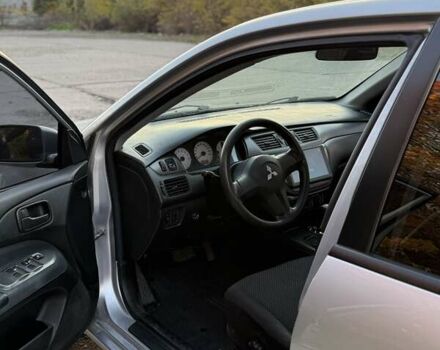 Серый Мицубиси Лансер, объемом двигателя 1.58 л и пробегом 145 тыс. км за 4800 $, фото 2 на Automoto.ua