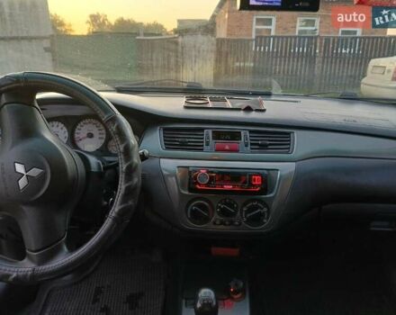 Серый Мицубиси Лансер, объемом двигателя 1.6 л и пробегом 234 тыс. км за 4300 $, фото 7 на Automoto.ua