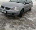 Серый Мицубиси Лансер, объемом двигателя 1.58 л и пробегом 400 тыс. км за 4100 $, фото 1 на Automoto.ua