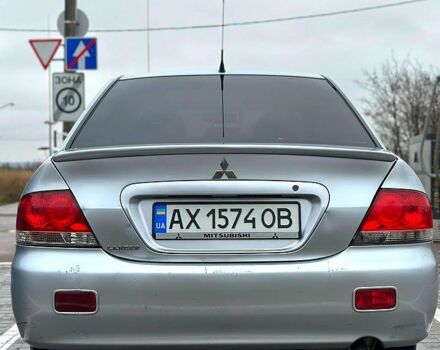 Серый Мицубиси Лансер, объемом двигателя 1.6 л и пробегом 165 тыс. км за 4000 $, фото 2 на Automoto.ua