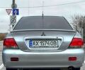 Серый Мицубиси Лансер, объемом двигателя 1.6 л и пробегом 165 тыс. км за 4000 $, фото 2 на Automoto.ua