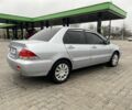 Сірий Міцубісі Lancer, об'ємом двигуна 1.6 л та пробігом 240 тис. км за 4650 $, фото 7 на Automoto.ua