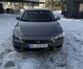 Серый Мицубиси Лансер, объемом двигателя 1.5 л и пробегом 231 тыс. км за 5300 $, фото 1 на Automoto.ua