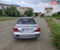 Серый Мицубиси Лансер, объемом двигателя 1.6 л и пробегом 210 тыс. км за 4123 $, фото 2 на Automoto.ua