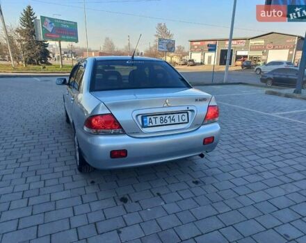 Серый Мицубиси Лансер, объемом двигателя 1.6 л и пробегом 228 тыс. км за 2999 $, фото 16 на Automoto.ua