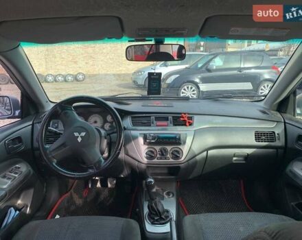 Серый Мицубиси Лансер, объемом двигателя 1.58 л и пробегом 227 тыс. км за 3599 $, фото 18 на Automoto.ua