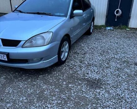 Серый Мицубиси Лансер, объемом двигателя 1.58 л и пробегом 227 тыс. км за 3200 $, фото 2 на Automoto.ua