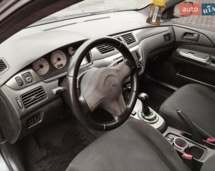Сірий Міцубісі Lancer, об'ємом двигуна 1.58 л та пробігом 209 тис. км за 2900 $, фото 14 на Automoto.ua