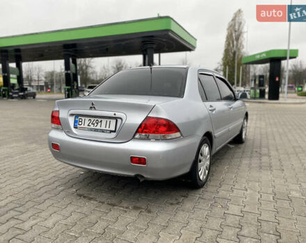 Сірий Міцубісі Lancer, об'ємом двигуна 1.58 л та пробігом 280 тис. км за 4650 $, фото 5 на Automoto.ua