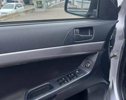 Серый Мицубиси Лансер, объемом двигателя 1.5 л и пробегом 190 тыс. км за 5800 $, фото 7 на Automoto.ua