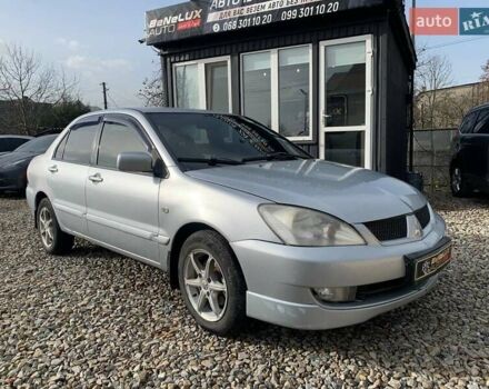 Серый Мицубиси Лансер, объемом двигателя 1.58 л и пробегом 227 тыс. км за 3599 $, фото 2 на Automoto.ua