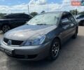 Сірий Міцубісі Lancer, об'ємом двигуна 1.58 л та пробігом 304 тис. км за 4290 $, фото 1 на Automoto.ua