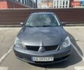 Серый Мицубиси Лансер, объемом двигателя 1.58 л и пробегом 206 тыс. км за 4999 $, фото 1 на Automoto.ua