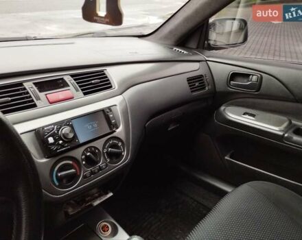 Сірий Міцубісі Lancer, об'ємом двигуна 1.58 л та пробігом 209 тис. км за 2900 $, фото 17 на Automoto.ua