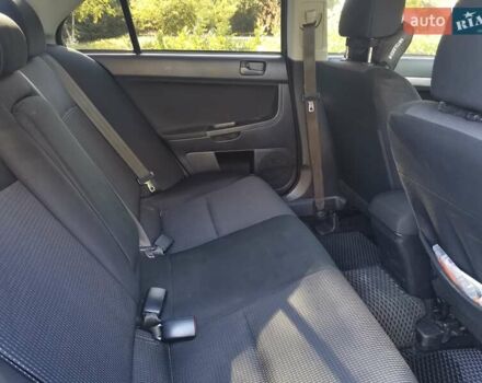 Серый Мицубиси Лансер, объемом двигателя 1.5 л и пробегом 183 тыс. км за 5900 $, фото 5 на Automoto.ua