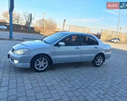 Серый Мицубиси Лансер, объемом двигателя 1.6 л и пробегом 228 тыс. км за 2999 $, фото 21 на Automoto.ua