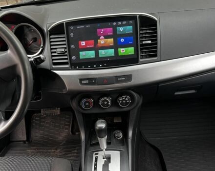 Серый Мицубиси Лансер, объемом двигателя 1.5 л и пробегом 170 тыс. км за 9000 $, фото 2 на Automoto.ua