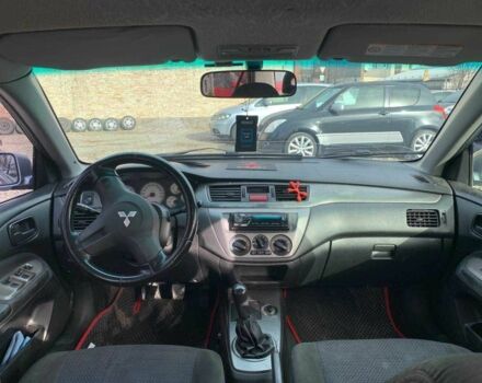 Серый Мицубиси Лансер, объемом двигателя 1.6 л и пробегом 227 тыс. км за 3599 $, фото 18 на Automoto.ua