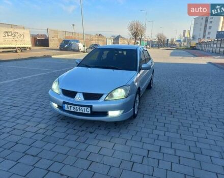 Серый Мицубиси Лансер, объемом двигателя 1.6 л и пробегом 228 тыс. км за 2999 $, фото 3 на Automoto.ua