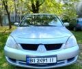 Сірий Міцубісі Lancer, об'ємом двигуна 1.6 л та пробігом 244 тис. км за 4699 $, фото 1 на Automoto.ua