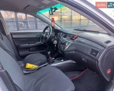 Серый Мицубиси Лансер, объемом двигателя 1.6 л и пробегом 228 тыс. км за 2999 $, фото 29 на Automoto.ua