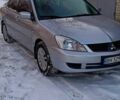 Серый Мицубиси Лансер, объемом двигателя 1.6 л и пробегом 180 тыс. км за 4750 $, фото 1 на Automoto.ua