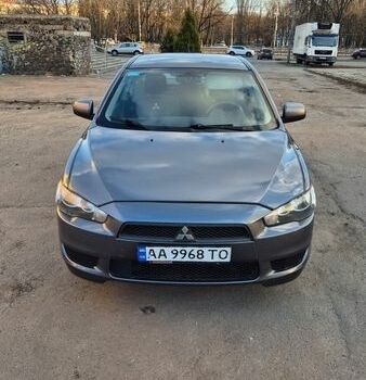 Серый Мицубиси Лансер, объемом двигателя 1.5 л и пробегом 248 тыс. км за 6000 $, фото 1 на Automoto.ua