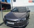 Серый Мицубиси Лансер, объемом двигателя 1.5 л и пробегом 232 тыс. км за 4700 $, фото 1 на Automoto.ua