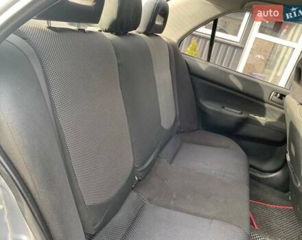 Серый Мицубиси Лансер, объемом двигателя 1.58 л и пробегом 227 тыс. км за 3599 $, фото 17 на Automoto.ua