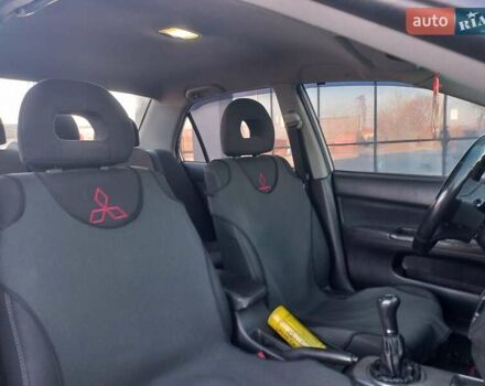 Серый Мицубиси Лансер, объемом двигателя 1.6 л и пробегом 228 тыс. км за 2999 $, фото 31 на Automoto.ua