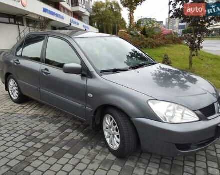 Сірий Міцубісі Lancer, об'ємом двигуна 1.58 л та пробігом 209 тис. км за 2900 $, фото 13 на Automoto.ua