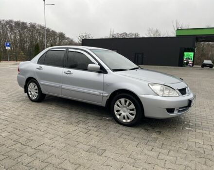 Сірий Міцубісі Lancer, об'ємом двигуна 1.6 л та пробігом 240 тис. км за 4650 $, фото 9 на Automoto.ua